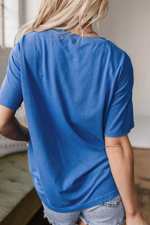 Blue oversized graphic t-shirt with short sleeves and a crew neck, shown from the back.