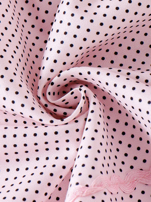 Pink polka dot baby dress with lace trim detail