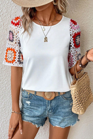 White tee with colorful granny square crochet sleeves and round neckline