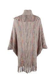 Textured knit cape in Khaki with multicolor stripes and fringe trim.