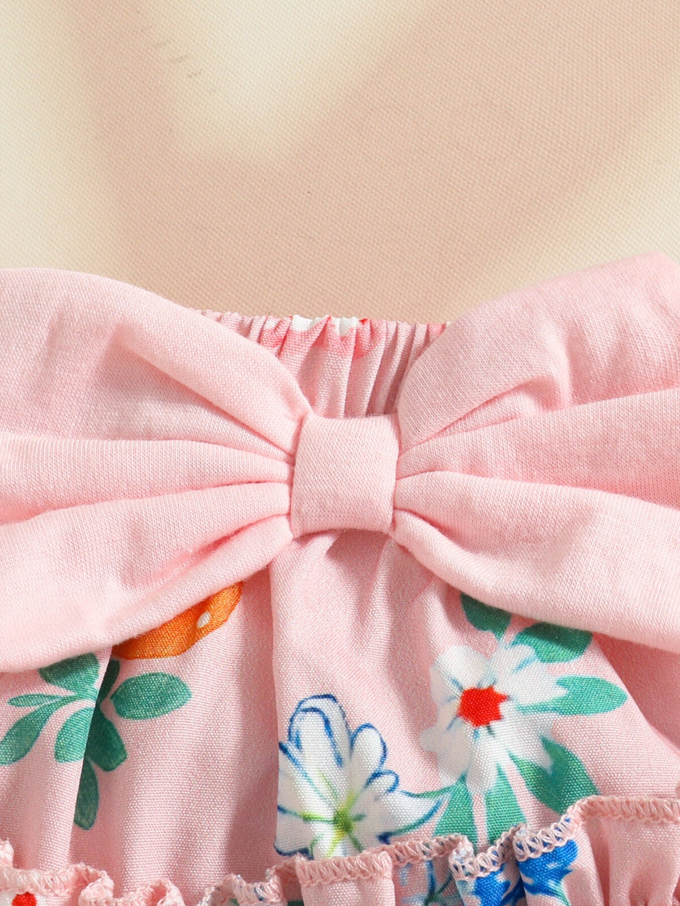 Pink baby set with floral print and large bow detail