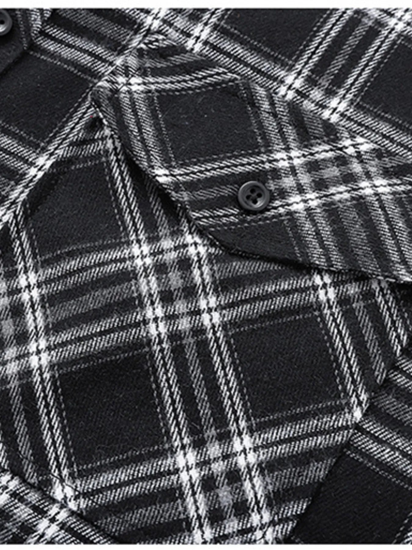 Men's black and white plaid button-up shirt with chest pocket detail.