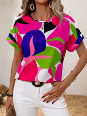Women's abstract floral print t-shirt in multi-color with short sleeves and a crew neck.