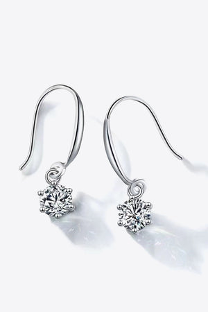 Silver drop earrings with cubic zirconia solitaire pendants.