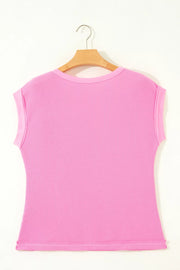 Pink waffled seam pocketed casual t-shirt with short sleeves and a crew neck.