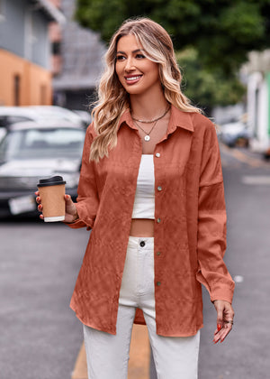 Textured overshirt in caramel with relaxed fit and buttoned front, styled open over a white top.