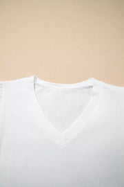 White cotton maternity t-shirt with V-neck and delicate eyelet flutter sleeves.