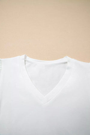 White cotton maternity t-shirt with V-neck and delicate eyelet flutter sleeves.