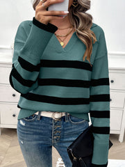 Turquoise and black striped knit polo sweater with a V-neck and collared neckline.