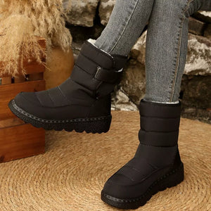 Black quilted round toe platform boots with adjustable strap and chunky sole