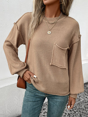 Camel knit sweater with raglan sleeves, crewneck, and a front pocket detail.
