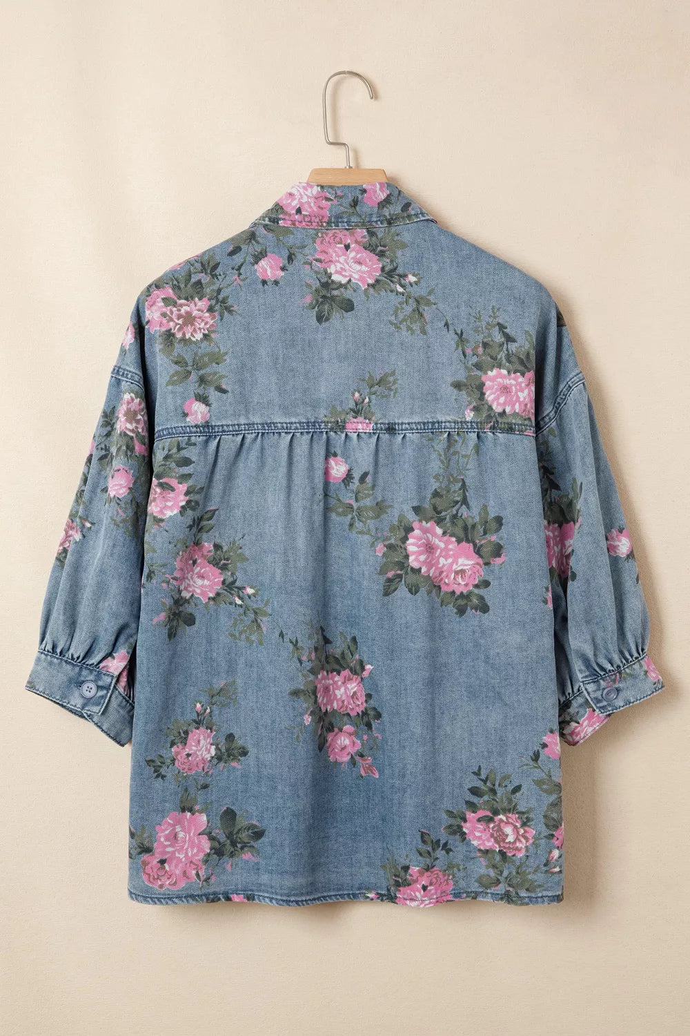 Denim button-up blouse with pink floral print, puff sleeves, and gathered back detail.