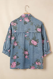 Denim button-up blouse with pink floral print, puff sleeves, and gathered back detail.