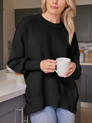 Black ribbed-knit relaxed fit sweater with crewneck and long sleeves.
