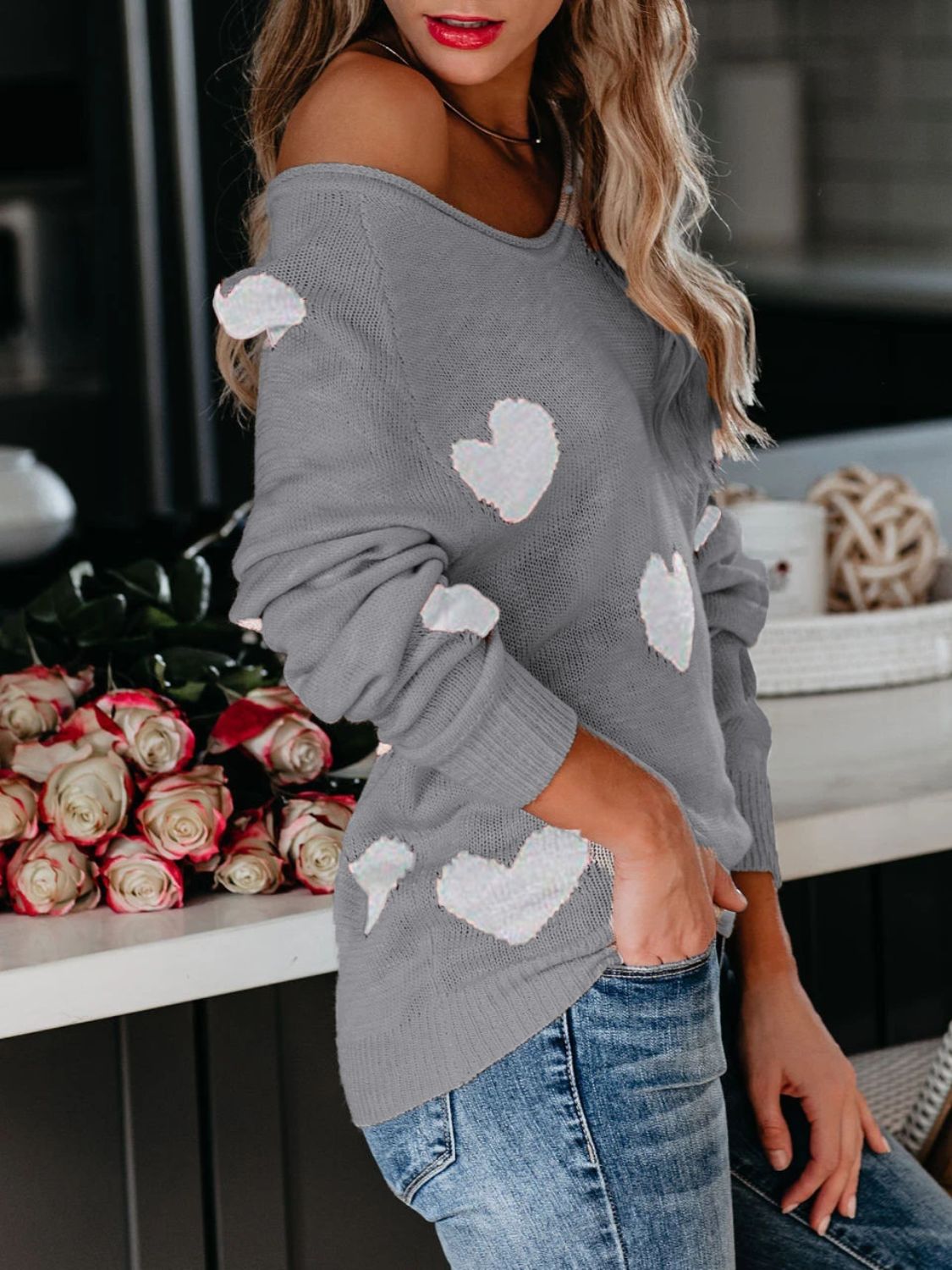 Gray raglan knit sweater with white heart motifs, off-the-shoulder neckline