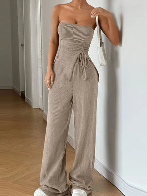 Ribbed knit tube top with drawstring detail and wide leg pants in beige.