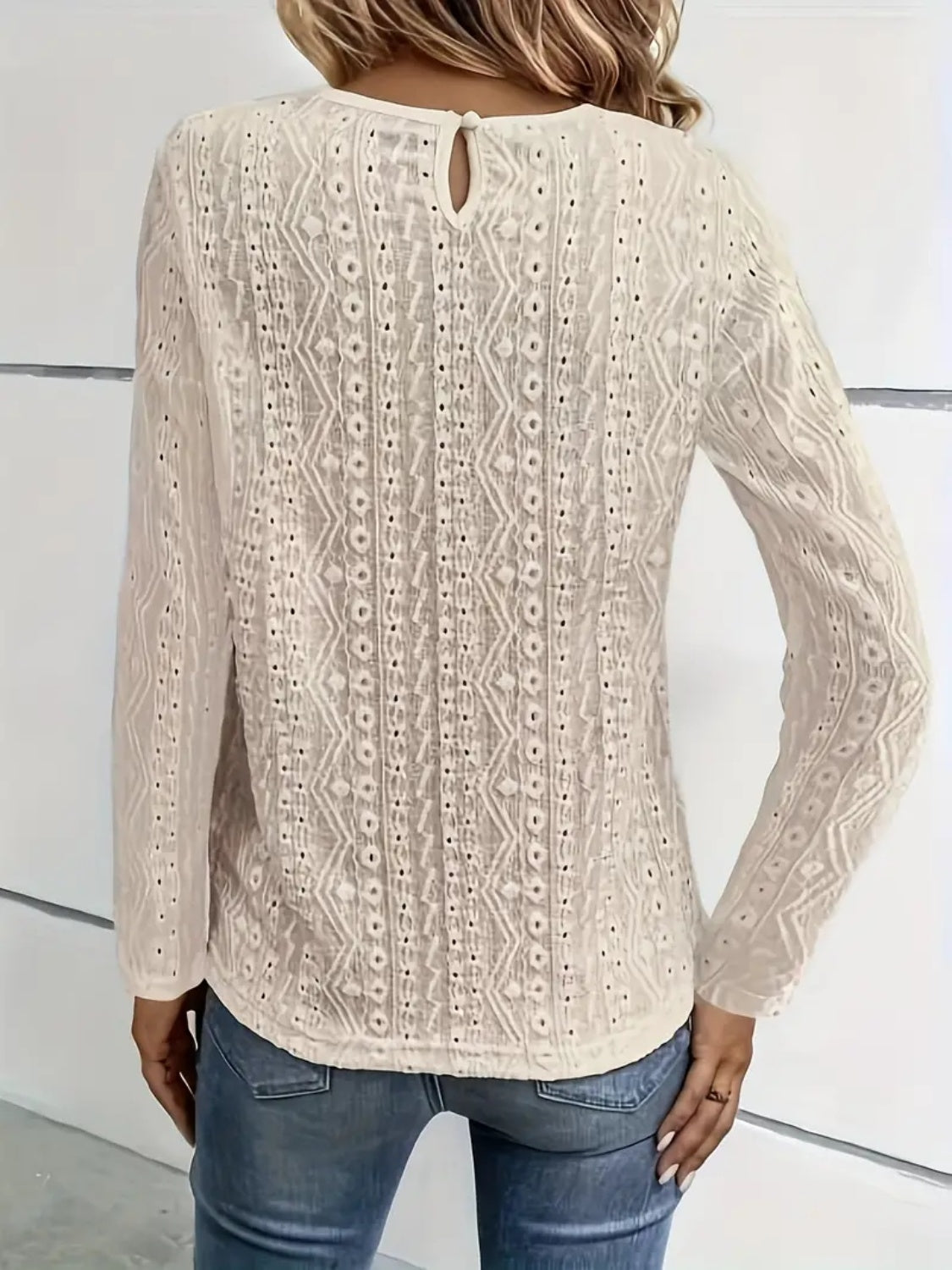 White eyelet embroidered blouse with lace yoke detail and keyhole back.