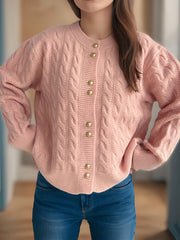 Dusty Pink cable knit cardigan with puff sleeves and gold buttons.