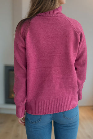 Speckled Donegal turtleneck sweater in cerise with ribbed cuffs and hem.