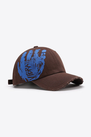 Chestnut baseball cap with distressed brim and blue VIBRA graffiti graphic.