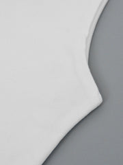 White flowy maxi dress detail showing soft fabric and wide strap seam.