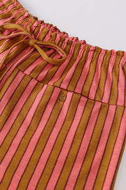 Wide leg pants with pink and brown stripes, drawstring waist, and button pocket detail.