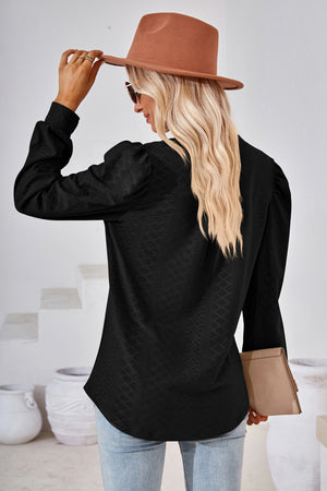 Black textured bishop sleeve blouse with a subtle diamond pattern.