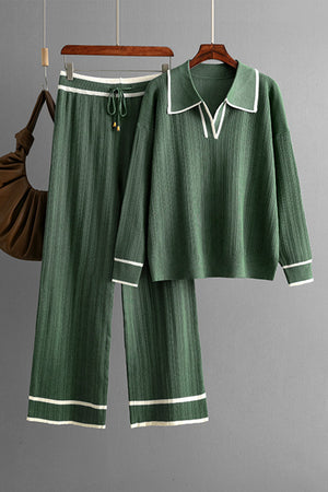 Dark green ribbed knit loungewear set with contrast trim, collared v-neck top and wide leg pants.