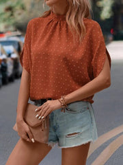Textured dot back-tie blouse in caramel with short sleeves and a mock neckline.