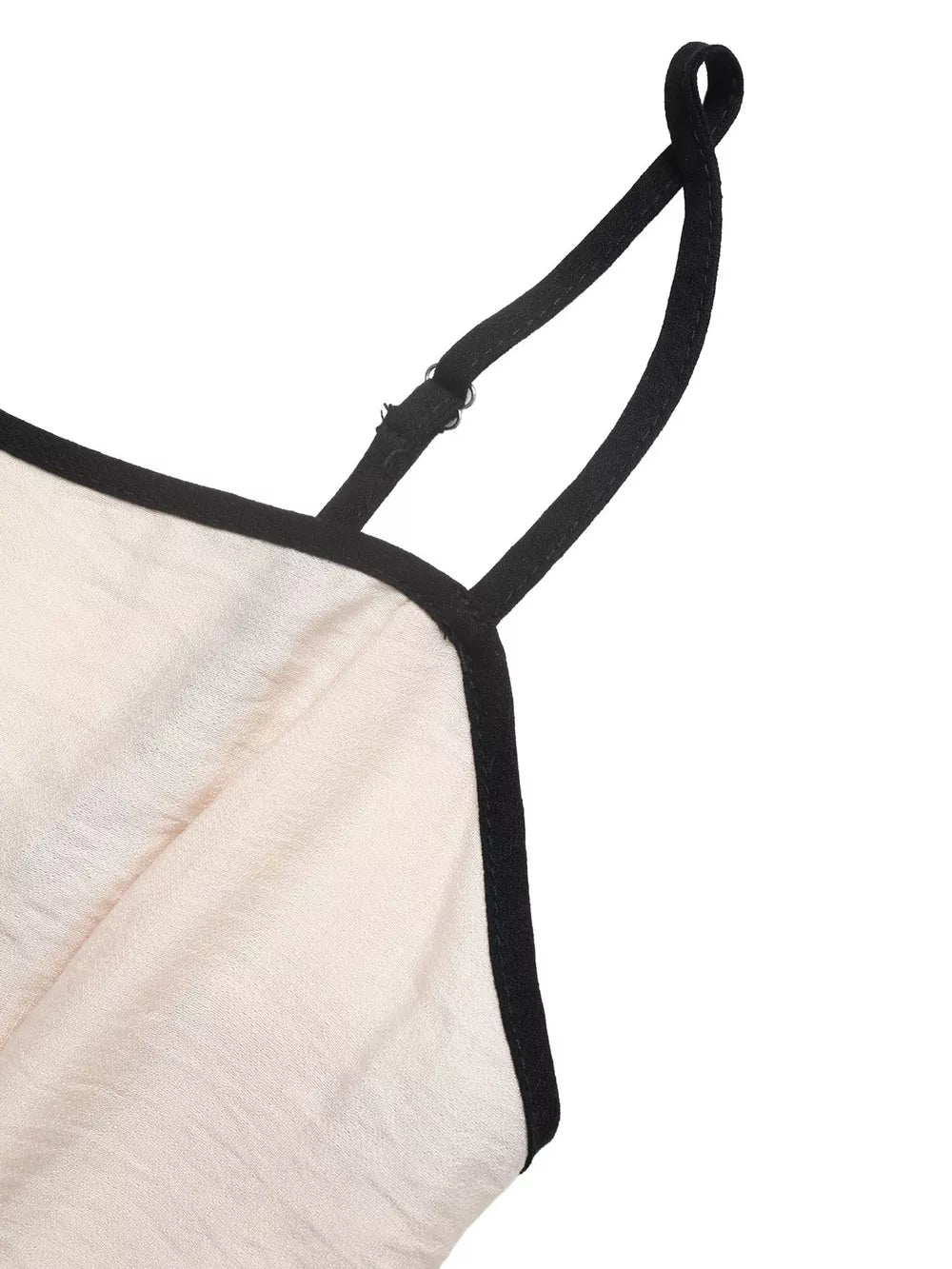 Chic contrast trim wide-leg romper in beige with adjustable spaghetti straps and black trim detail.