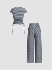 Striped crop top with drawstring sides and wide-leg pants set in navy blue.