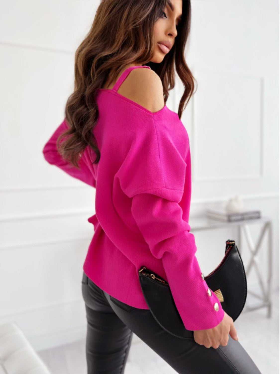 Hot Pink off-shoulder knit top with buckle detail and gold button accents.