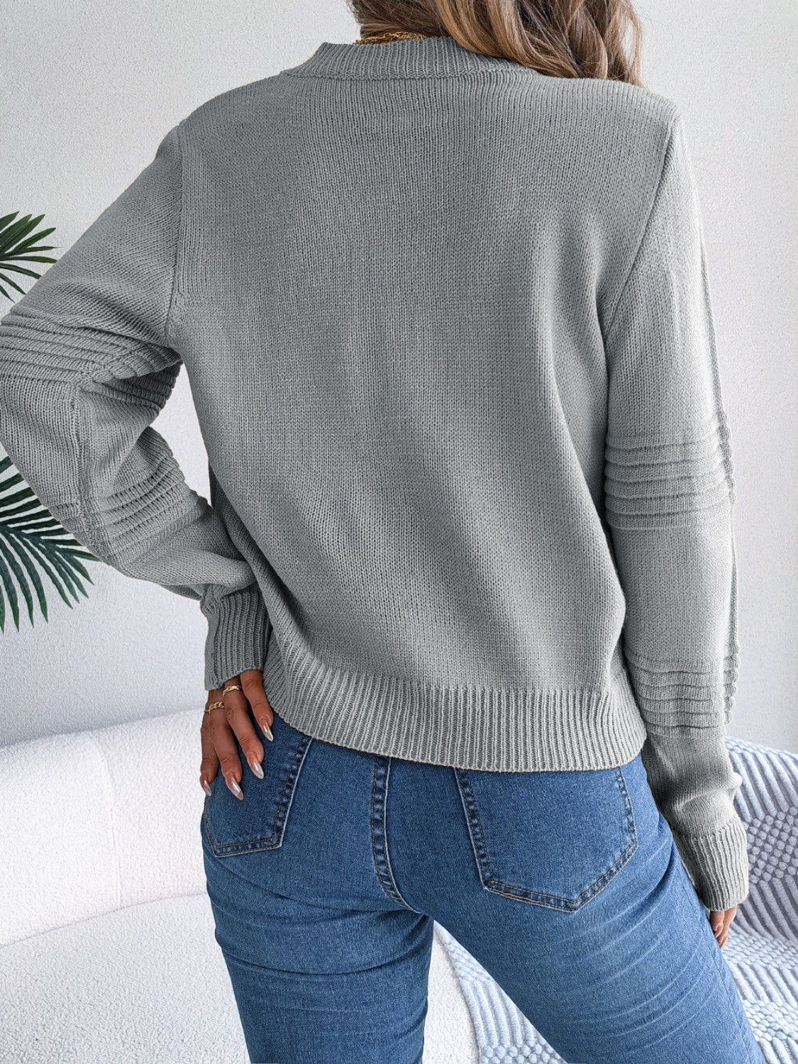 Dark gray acrylic knit sweater with ribbed yoke and sleeve detail.