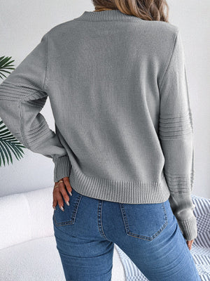 Dark gray acrylic knit sweater with ribbed yoke and sleeve detail.