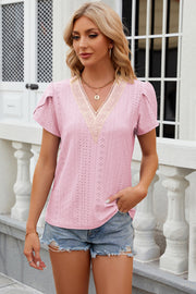 Blush pink eyelet flutter sleeve top with lace inset V-neckline, casual style.