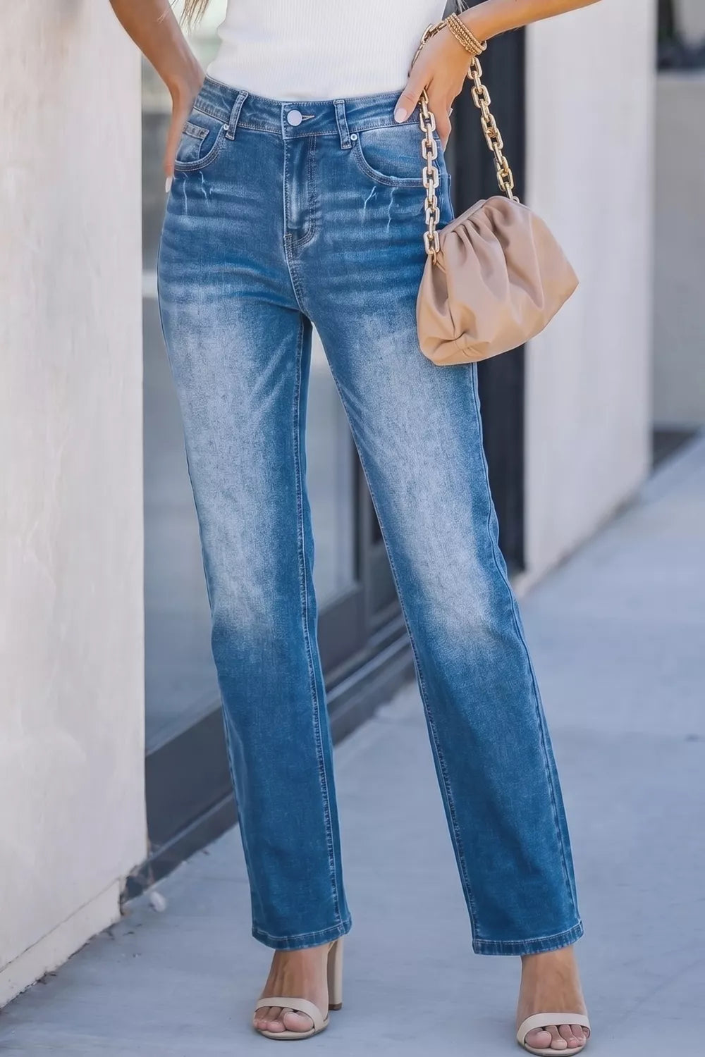 Acid-washed blue denim straight-leg jeans with a faded effect.