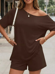 Dark brown asymmetrical one-shoulder top and shorts set with pockets.