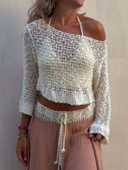 Beige asymmetric crochet crop top with open knit texture and off-the-shoulder neckline.