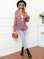 Rainbow knit buttoned cardigan with multicolor acrylic yarn and a relaxed fit.