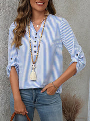 Light blue stripe v-neck blouse with roll-up sleeves and button detail.