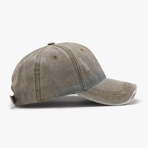 Faded denim baseball cap in Moss with distressed details and frayed brim.