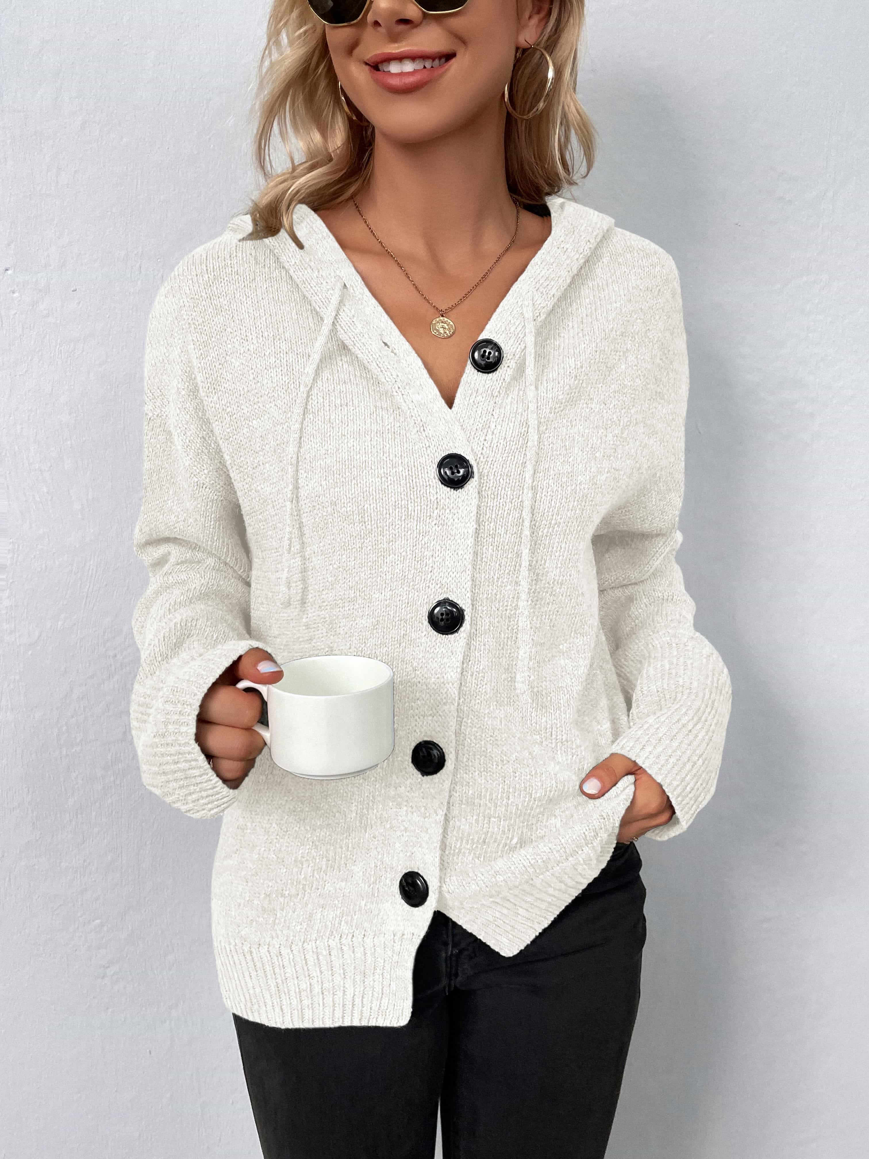 White button-front hooded knit cardigan with drawstring and black buttons.
