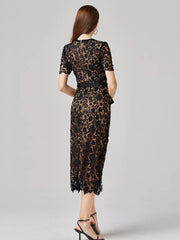 Black lace midi dress with short sleeves, a belted waist, and a zipper closure.