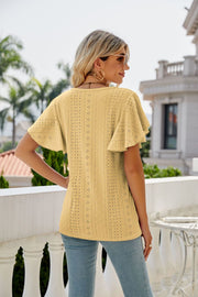 Yellow eyelet crew neck top with flounce sleeves