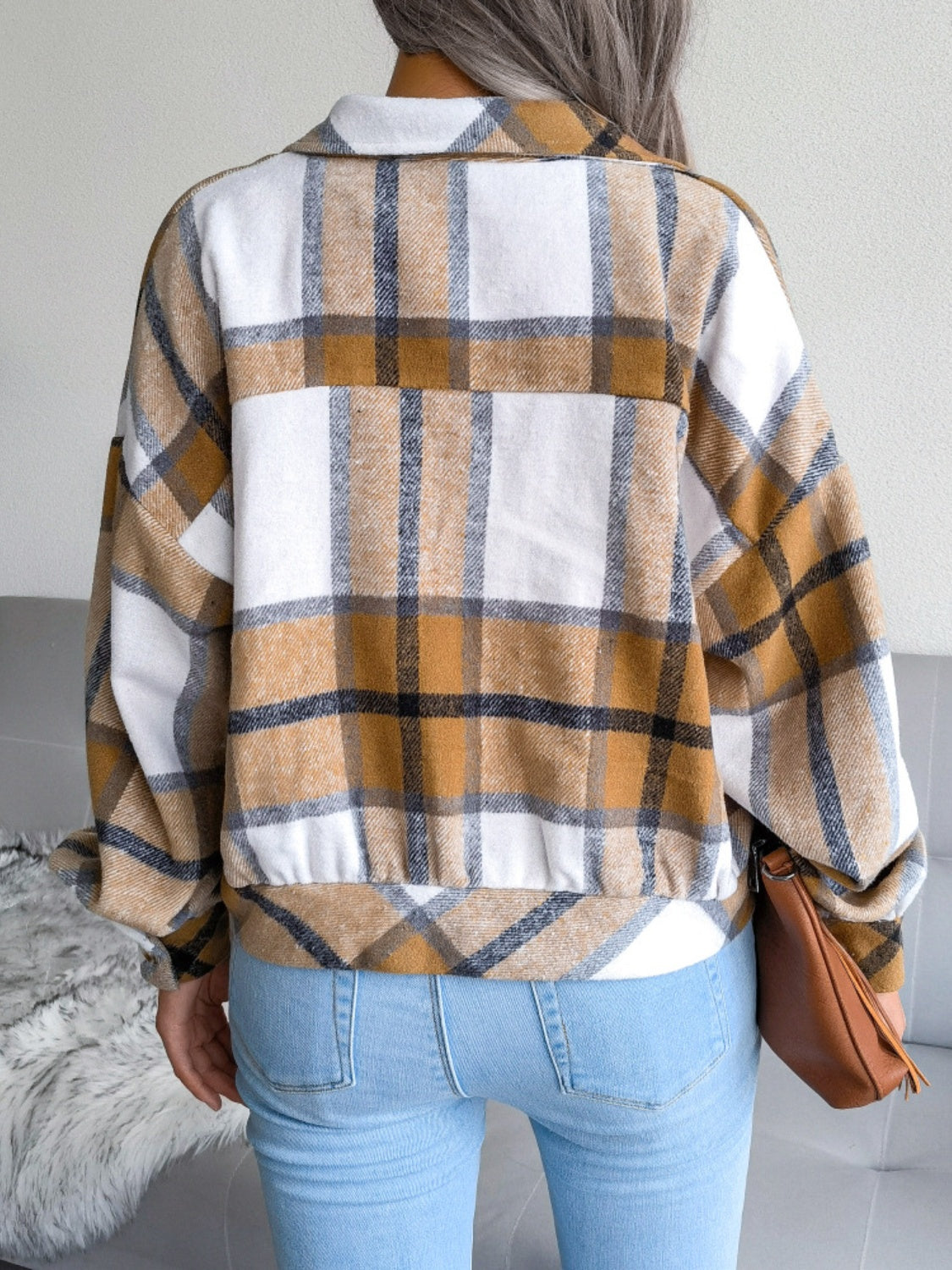 Oversized tartan shacket in camel and white with buttoned front and patch pockets.