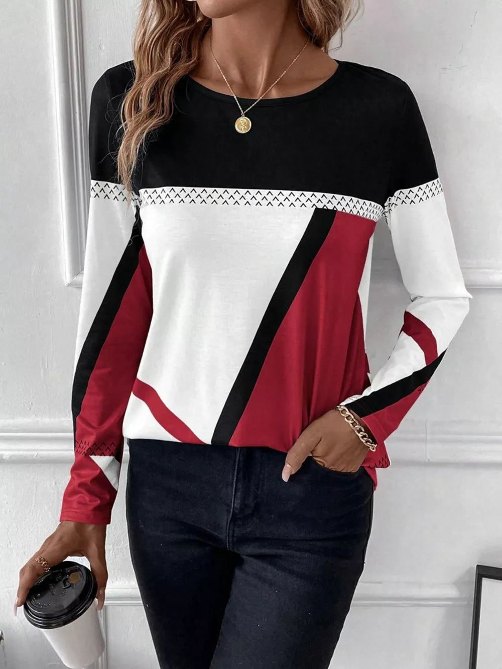 Geometric panel long sleeve t-shirt in black, white, and scarlet with chevron detail.