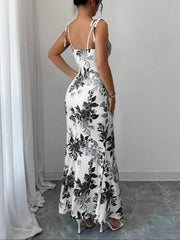 Maxi dress with floral print, tie straps, and a mermaid hem.