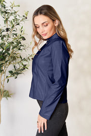 Navy faux leather biker jacket with mock neck and gold hardware detail