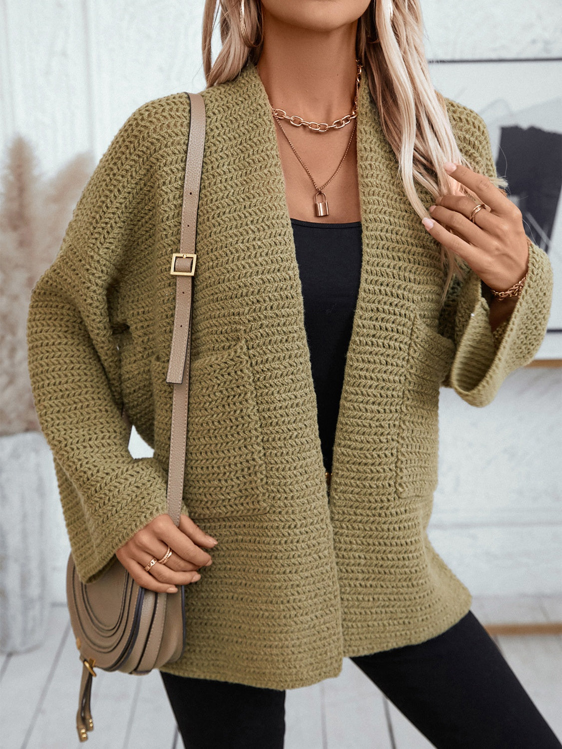 Moss chunky knit open front cardigan with pockets and relaxed fit.