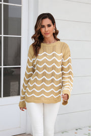 Khaki openwork sweater with white wavy stripes and crew neck.